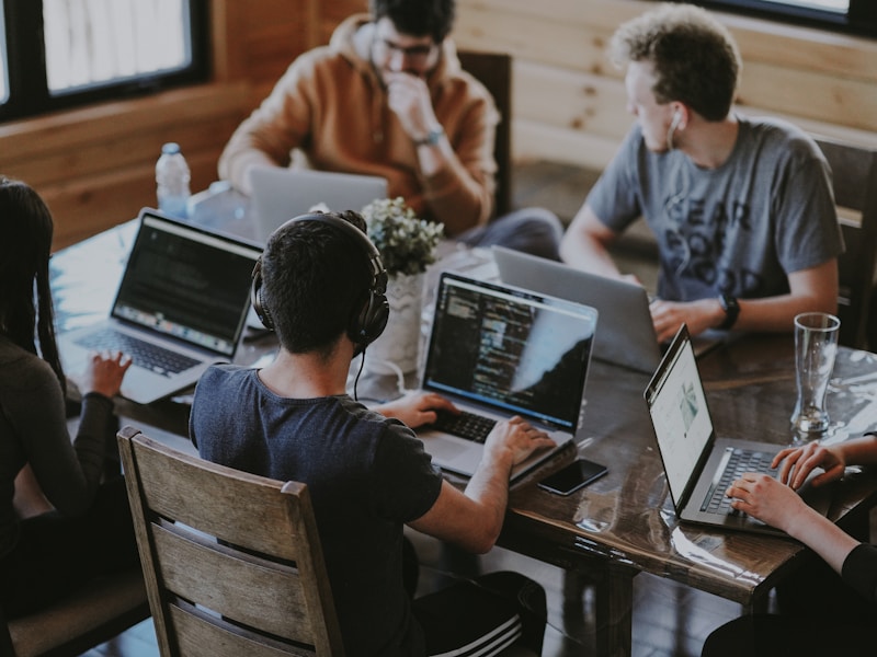 Owners working on their own laptops around one table